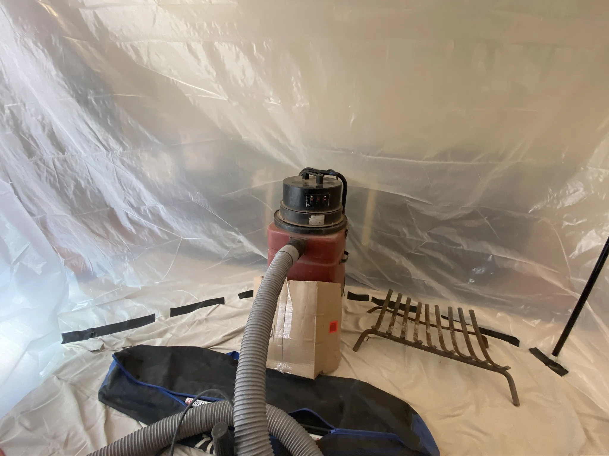 Clean chimney service with drop cloths and professional vacuums